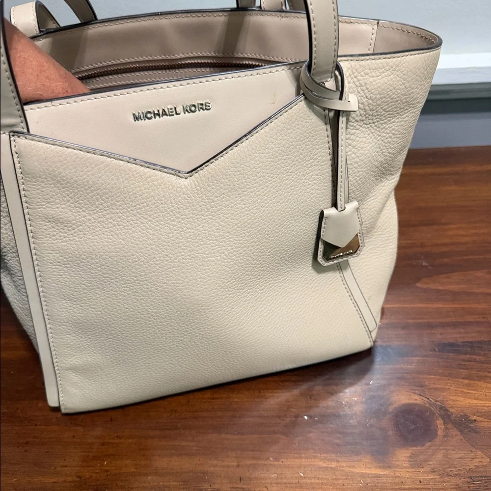 Beige medium sized Michael Kors handbag